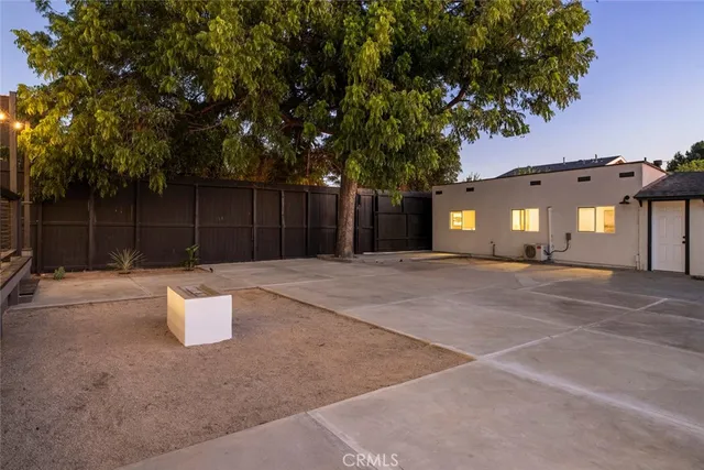 a view of a terrace with furniture and potted plants