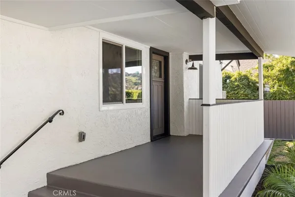a view of a hallway with windows