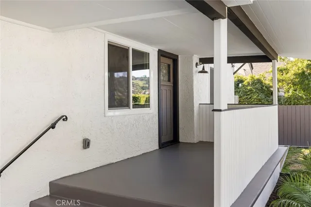 a view of a hallway with windows