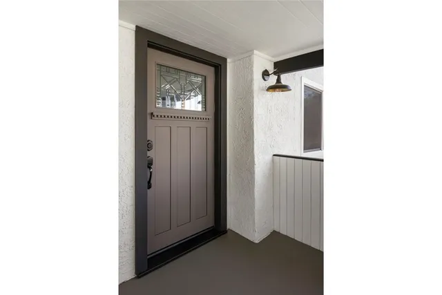 a view of a hallway with front door