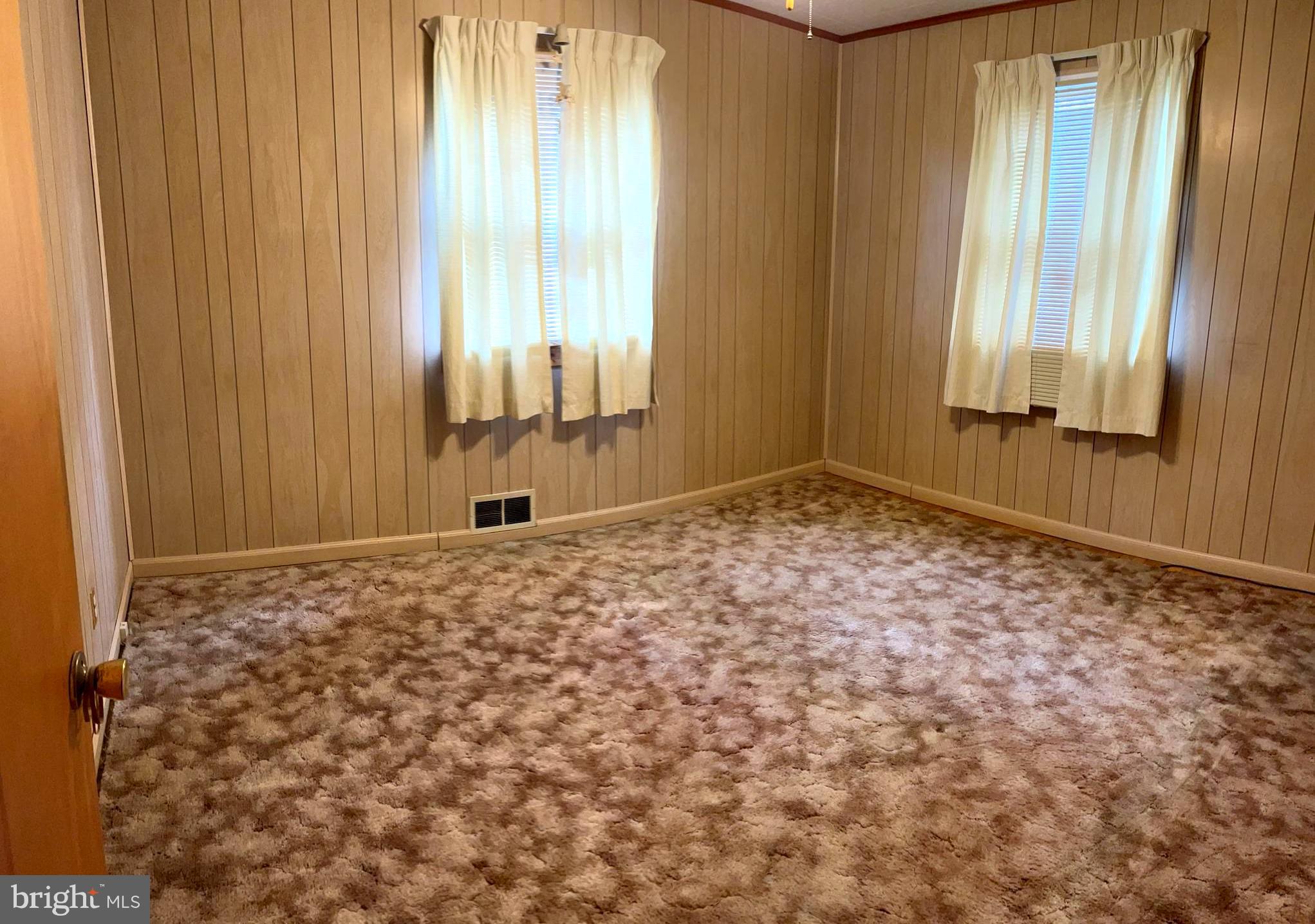 423 Meadow Road Baltimore, MD 21206 - Photo 11 of 20 a view of an empty room and window