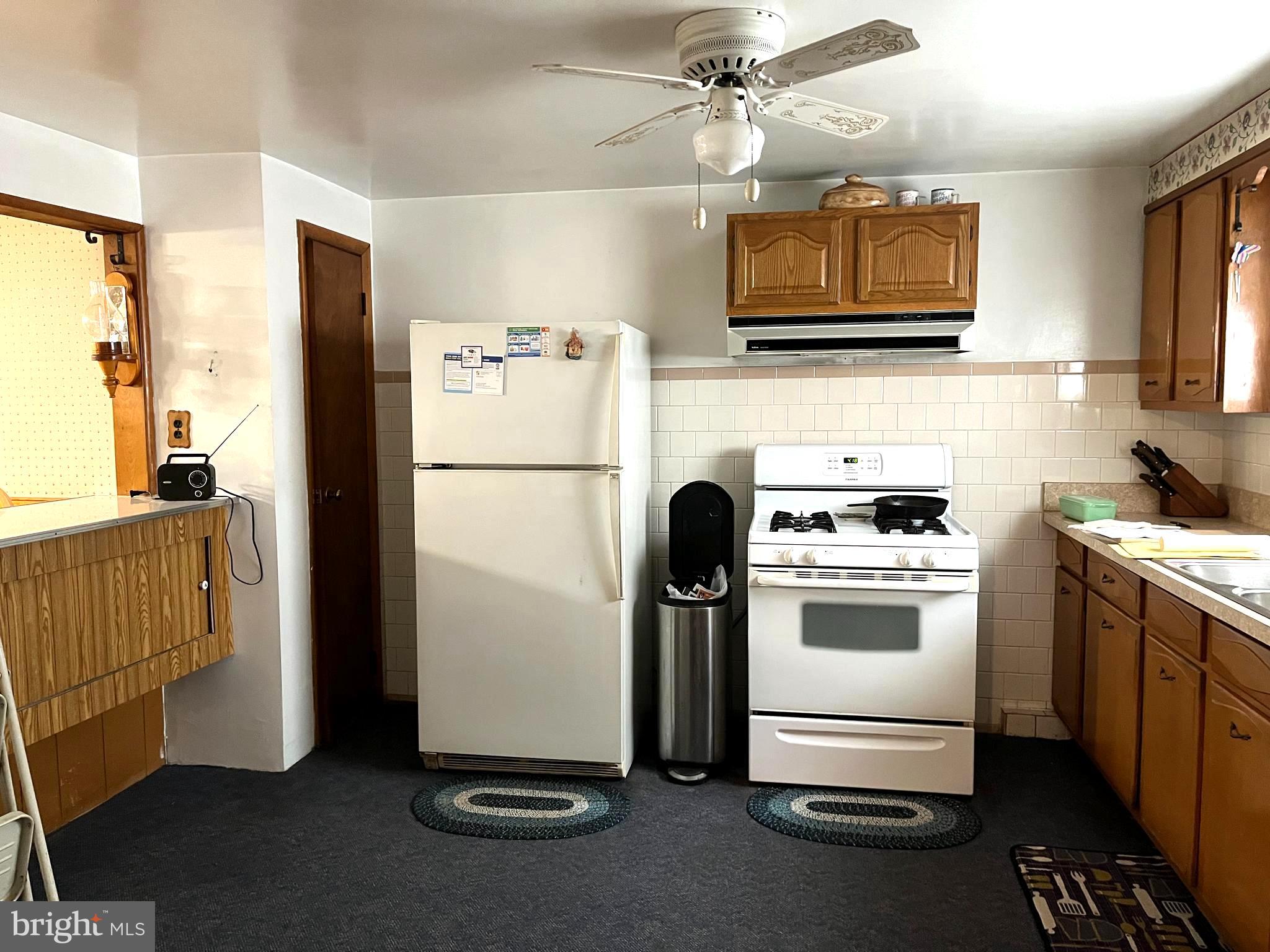 423 Meadow Road Baltimore, MD 21206 - Photo 14 of 20 a kitchen with stainless steel appliances a refrigerator stove and microwave