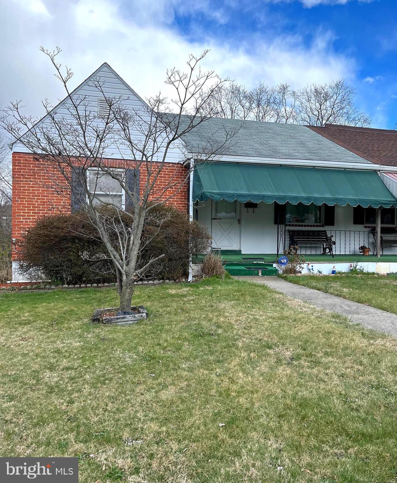 423 Meadow Road Baltimore, MD 21206 - Photo 2 of 20 a view of house with a yard