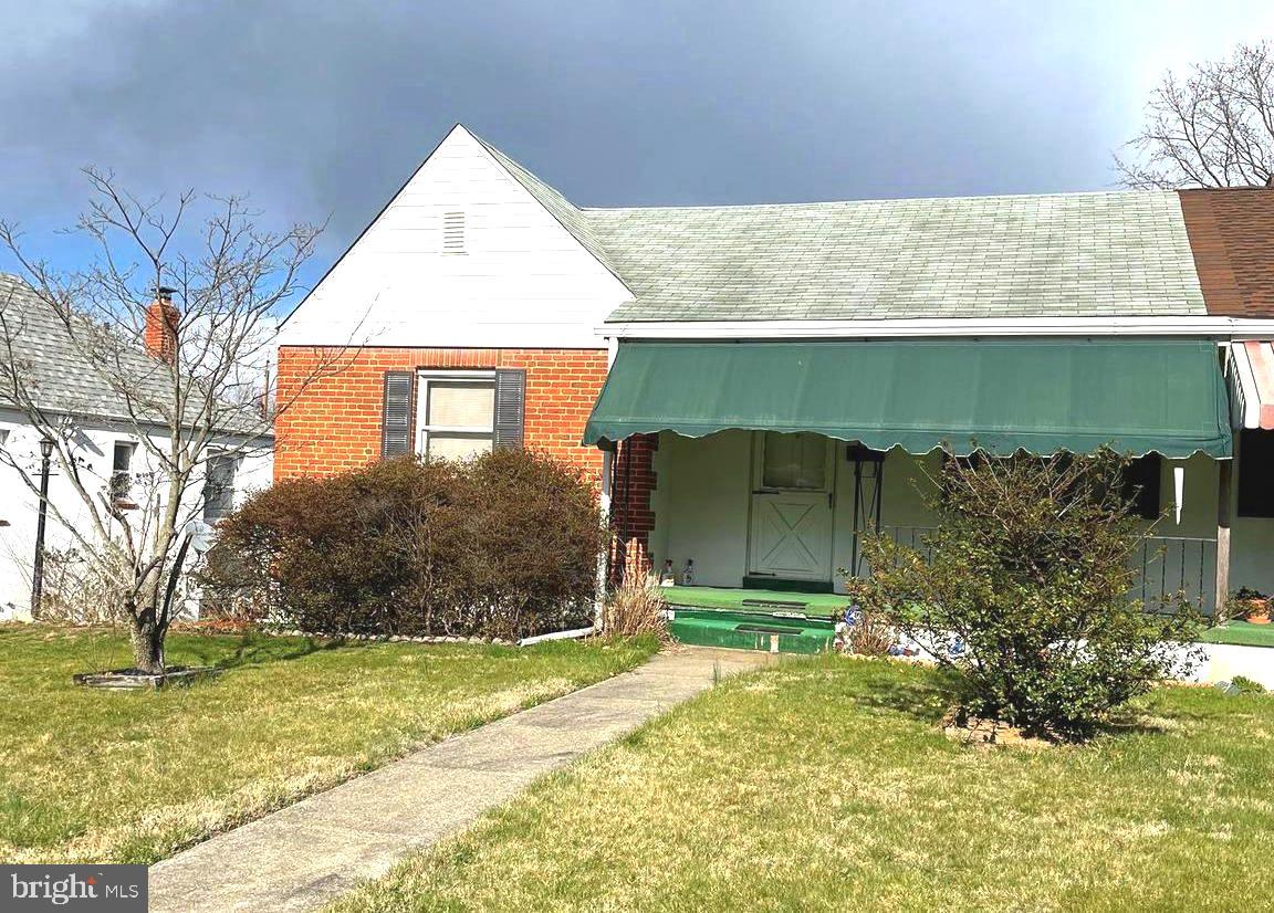 423 Meadow Road Baltimore, MD 21206 - Photo 3 of 20 a front view of a house with garden