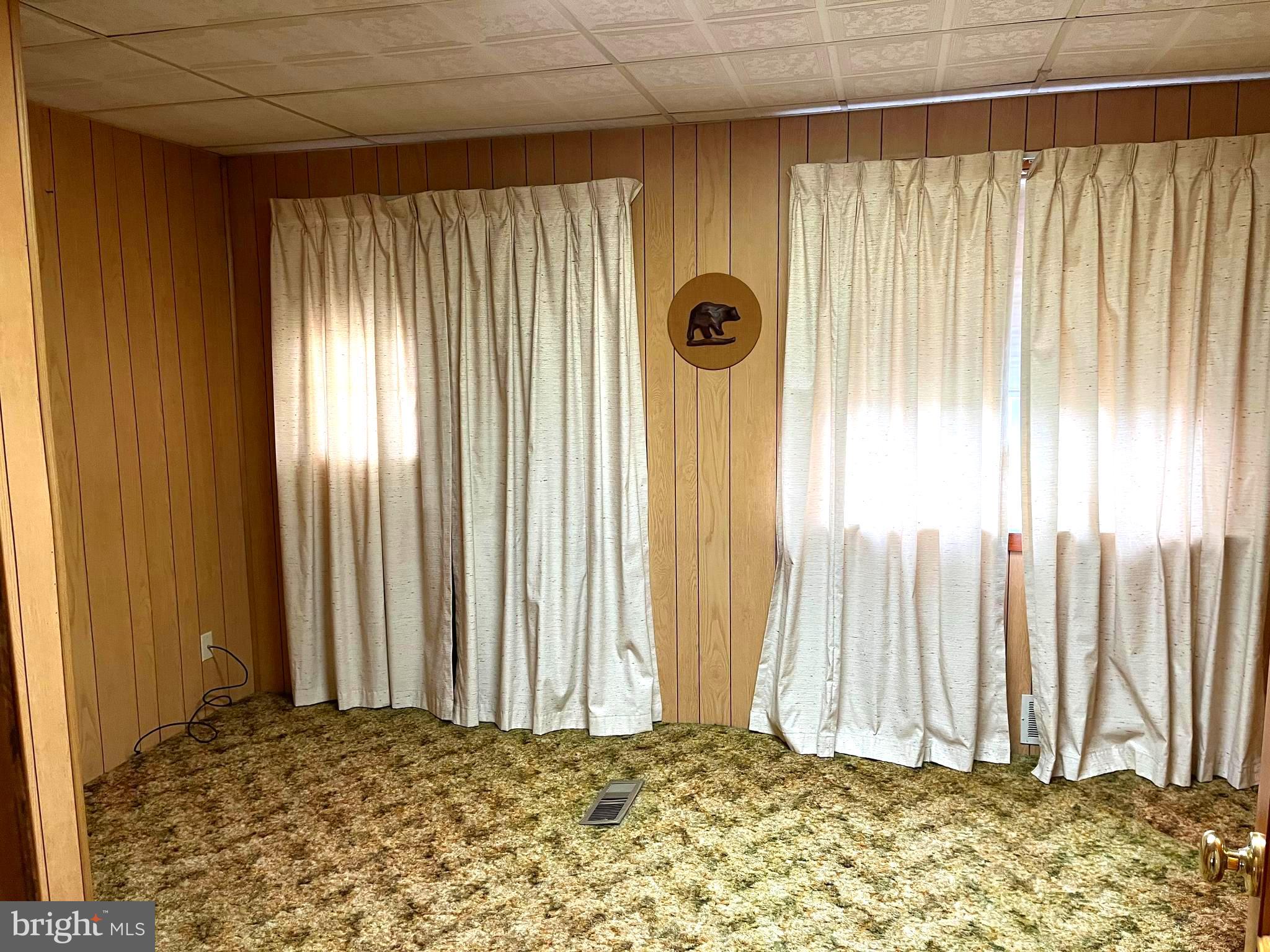 423 Meadow Road Baltimore, MD 21206 - Photo 6 of 20 a view of a room with a fireplace and a window