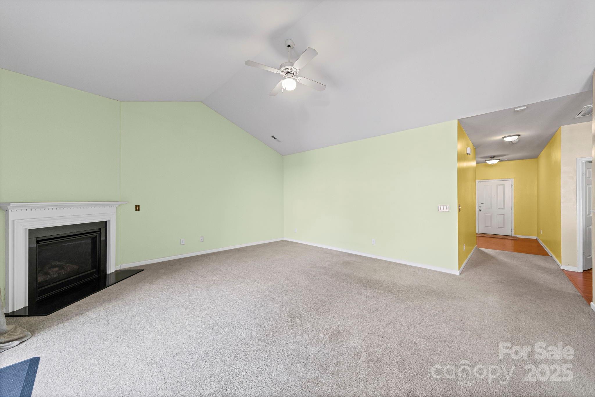11608 Downy Birch Road Charlotte, NC 28227 - Photo 11 of 38 a view of an empty room with a fireplace