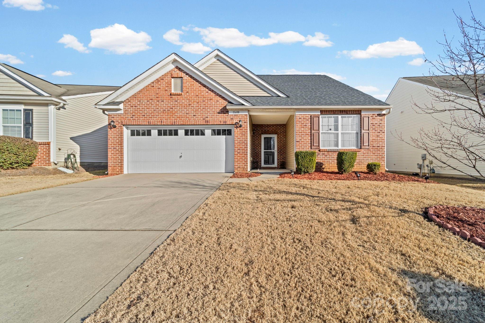11608 Downy Birch Road Charlotte, NC 28227 - Photo 14 of 38 a front view of a house with a yard