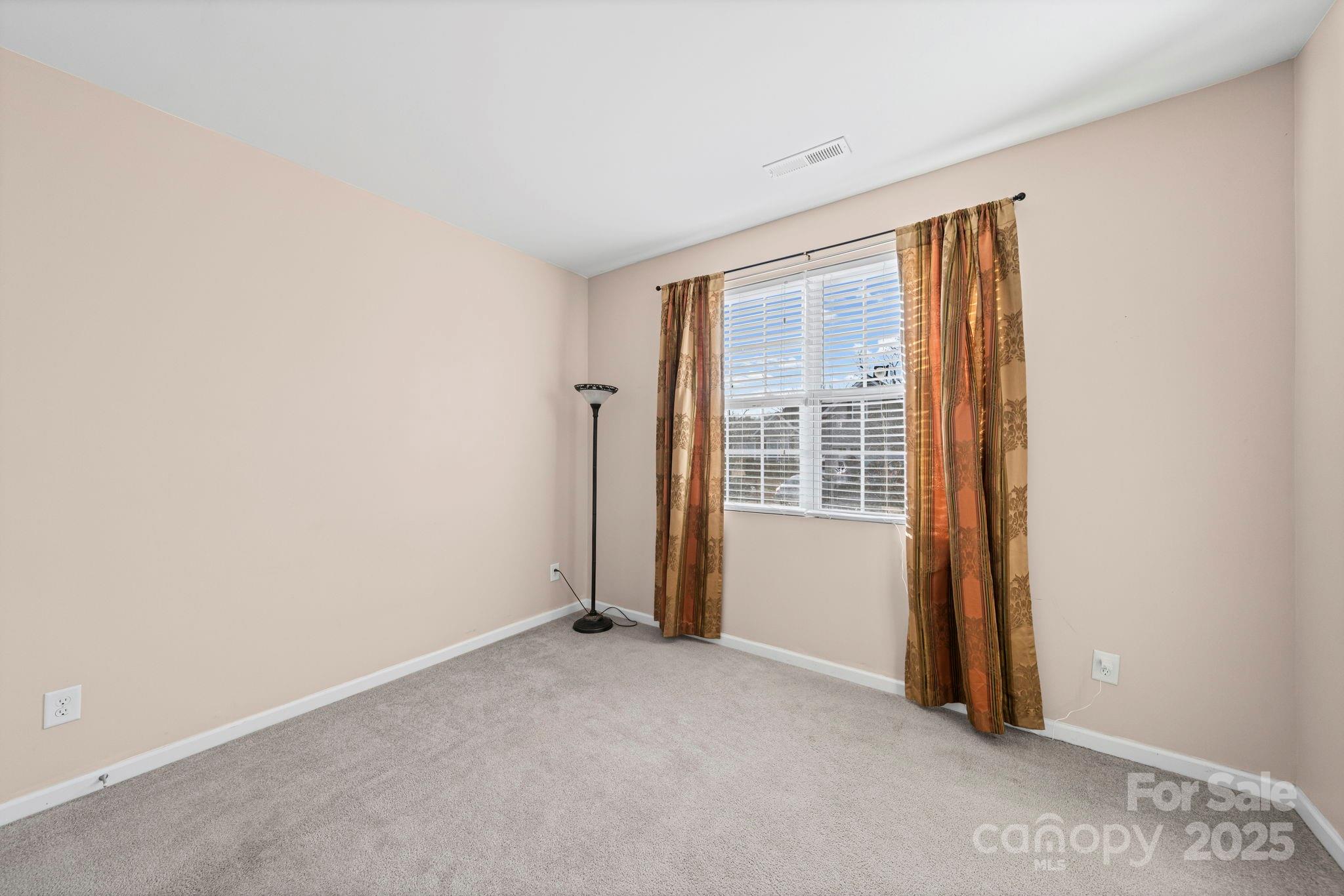 11608 Downy Birch Road Charlotte, NC 28227 - Photo 16 of 38 an empty room with windows