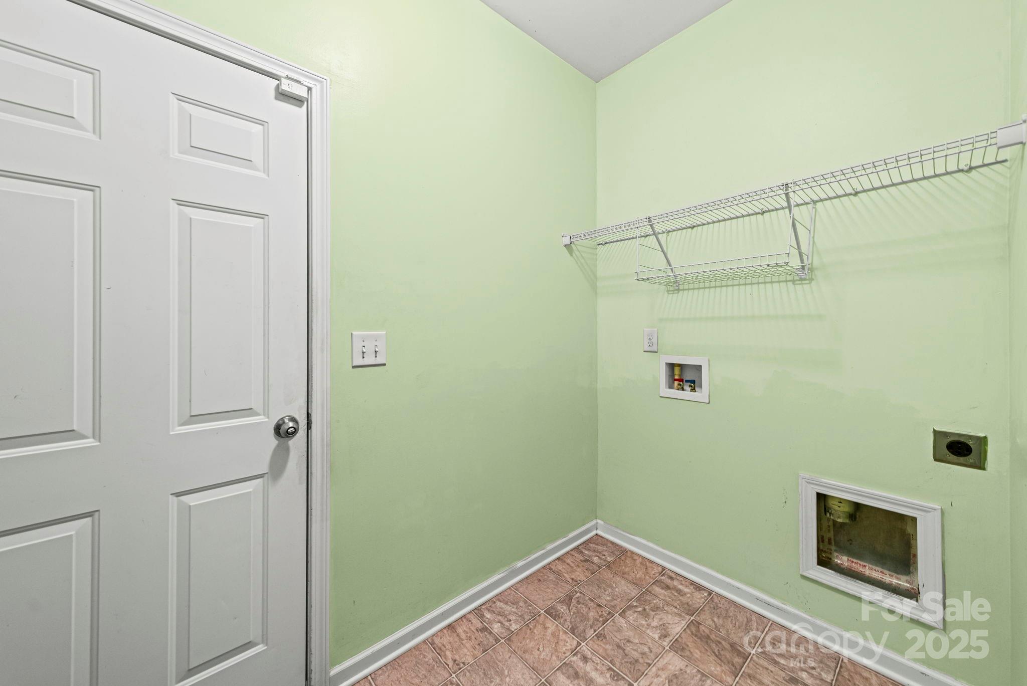 11608 Downy Birch Road Charlotte, NC 28227 - Photo 22 of 38 a view of a room with rack on the wall