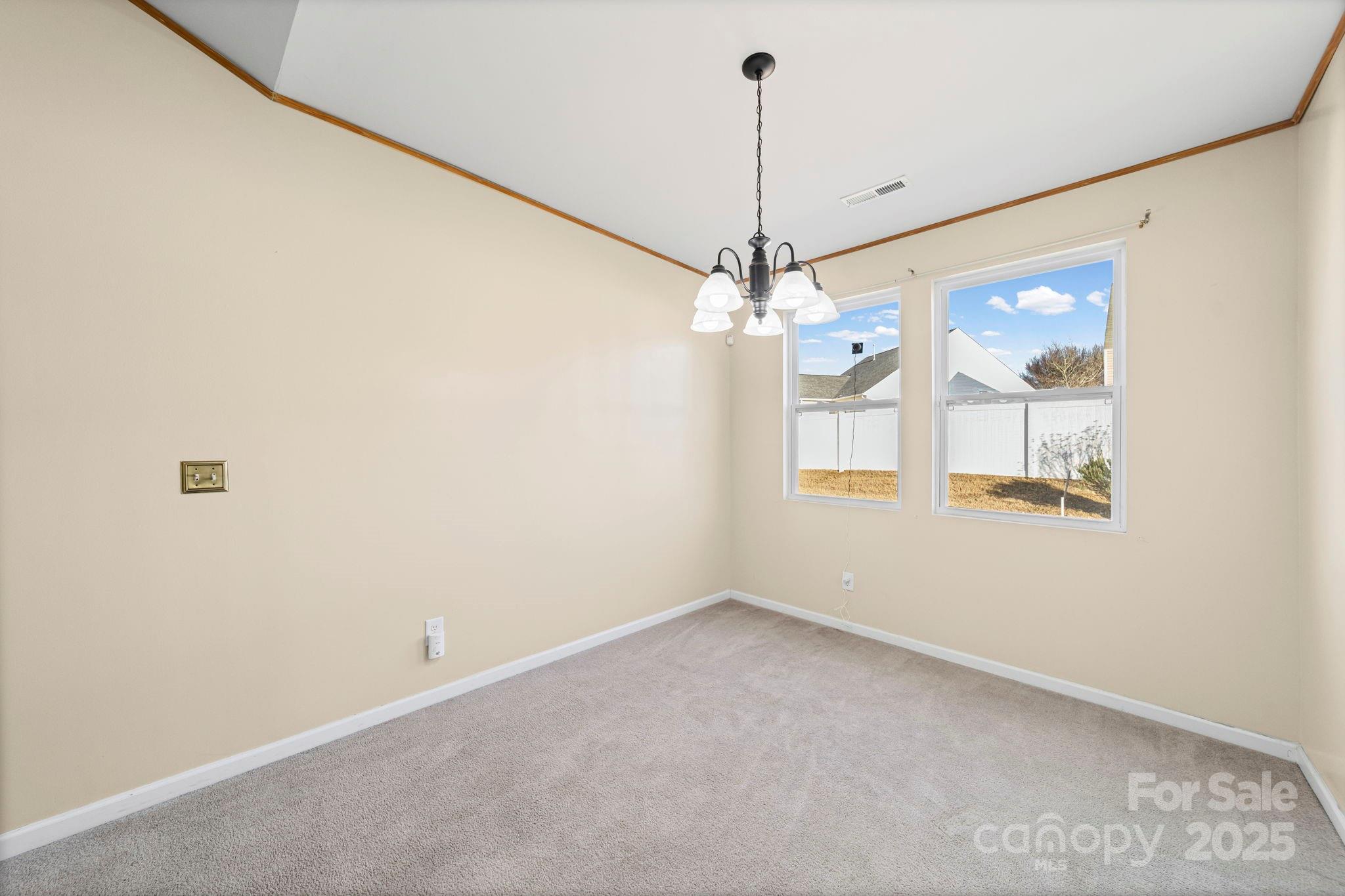 11608 Downy Birch Road Charlotte, NC 28227 - Photo 23 of 38 a view of an empty room with a window