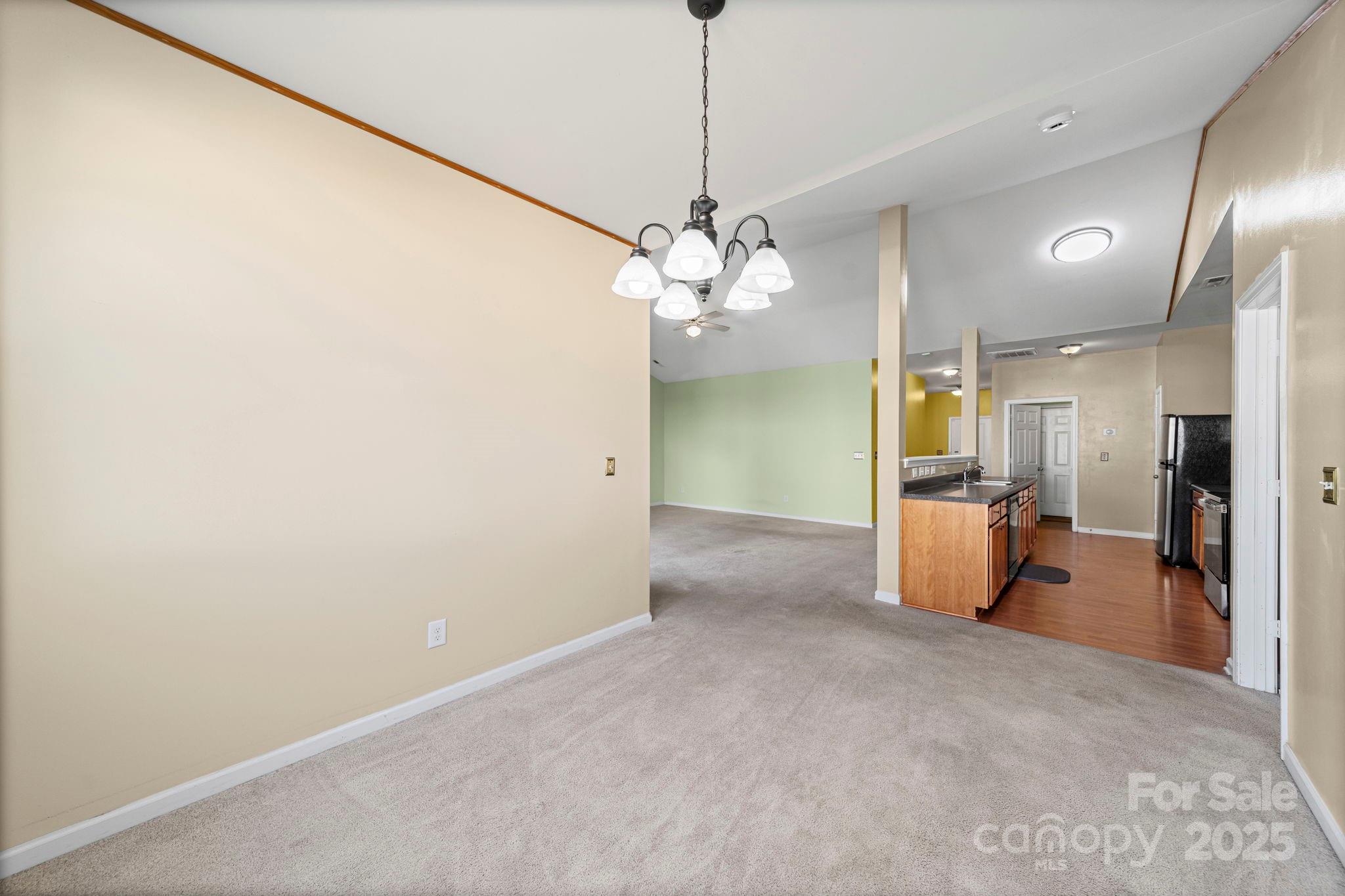 11608 Downy Birch Road Charlotte, NC 28227 - Photo 26 of 38 a view of a kitchen with a refrigerator and a sink