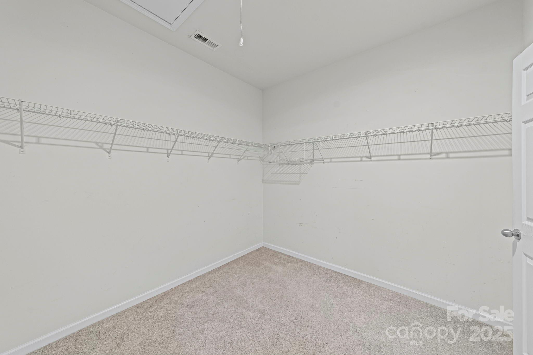 11608 Downy Birch Road Charlotte, NC 28227 - Photo 33 of 38 a view of a room with racks on the wall