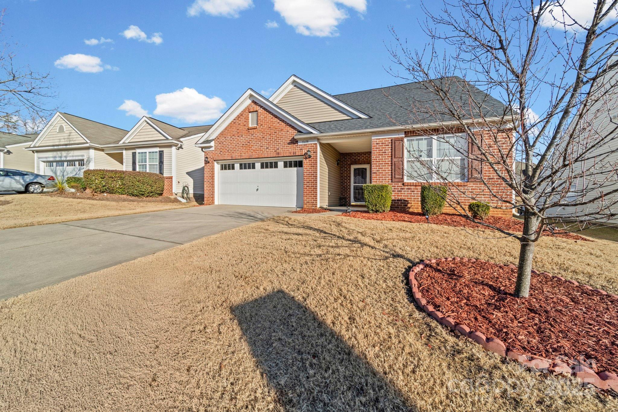 11608 Downy Birch Road Charlotte, NC 28227 - Photo 7 of 38 a front view of a house with a yard