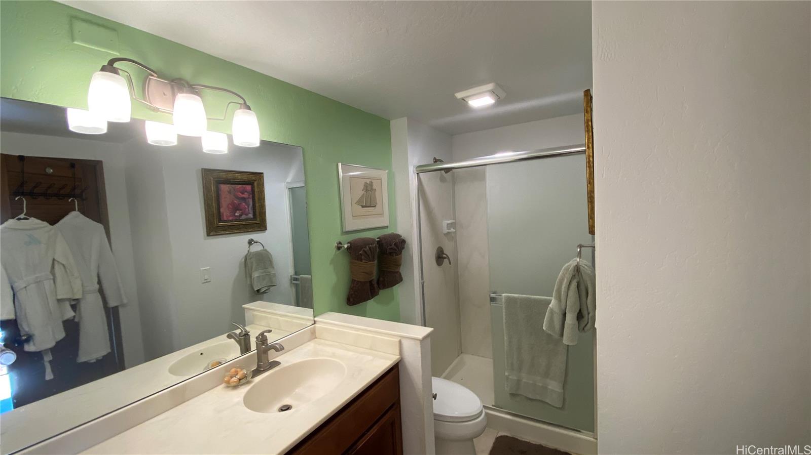 68-3840 Lua Kula Street, Unit E202 Waikoloa, HI 96738 - Photo 12 of 25 a bathroom with a sink toilet and shower
