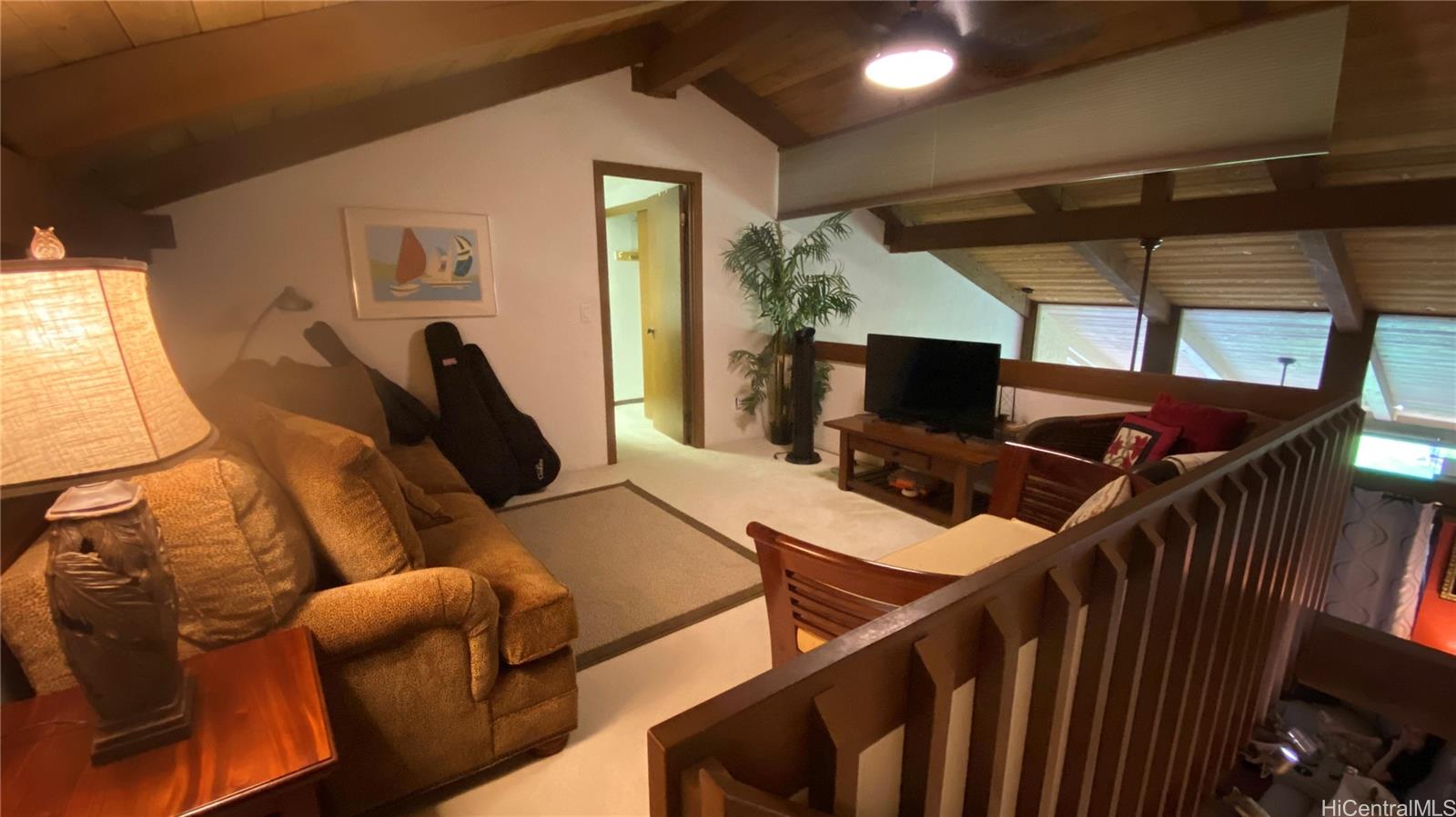 68-3840 Lua Kula Street, Unit E202 Waikoloa, HI 96738 - Photo 18 of 25 a living room with furniture and a flat screen tv