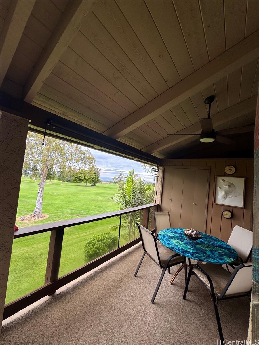 68-3840 Lua Kula Street, Unit E202 Waikoloa, HI 96738 - Photo 20 of 25 a view of a chairs and table in the patio
