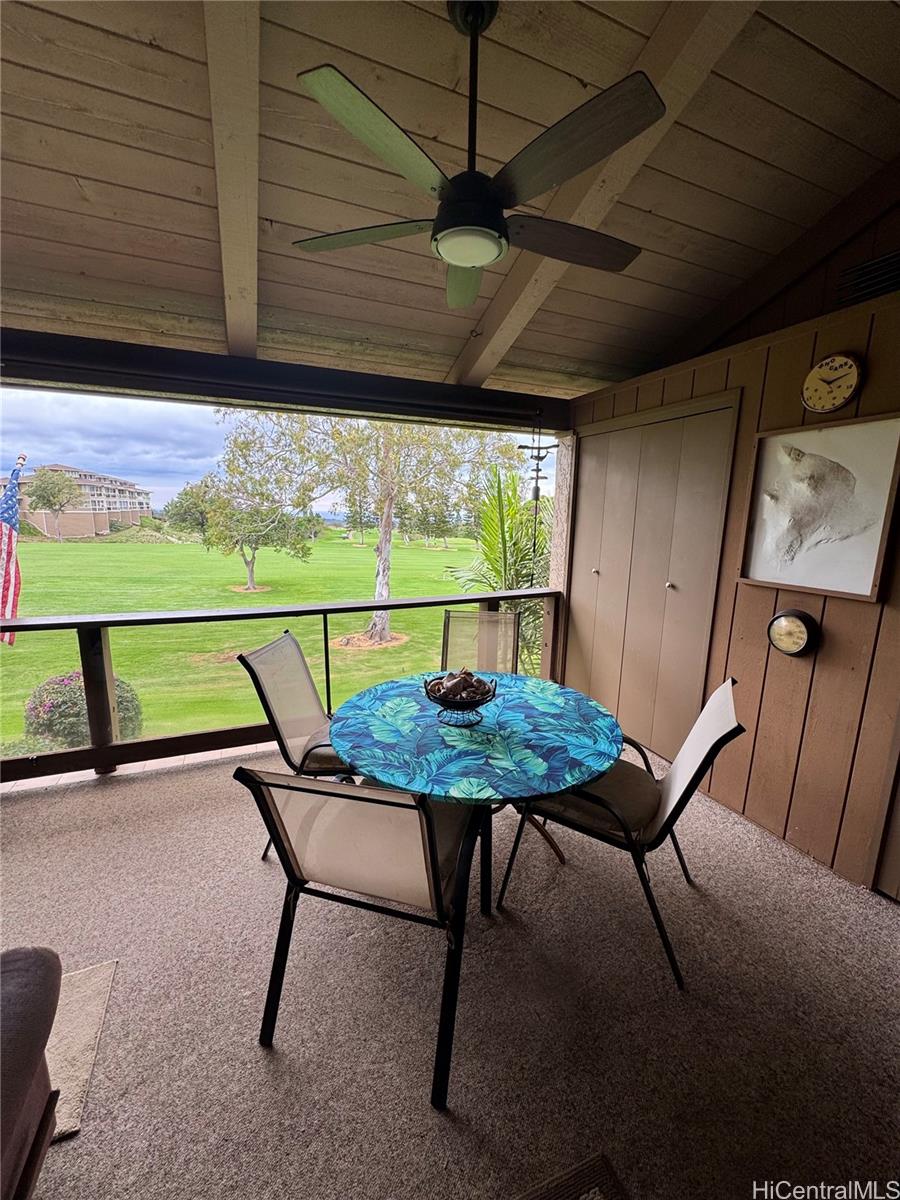 68-3840 Lua Kula Street, Unit E202 Waikoloa, HI 96738 - Photo 23 of 25 a balcony with furniture and a potted plant