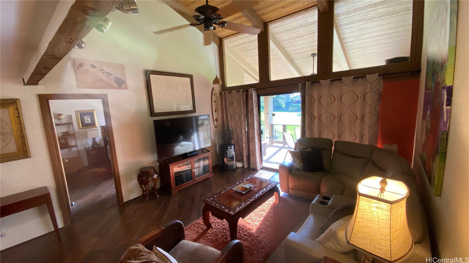68-3840 Lua Kula Street, Unit E202 Waikoloa, HI 96738 - Photo 9 of 25 a living room with furniture and a flat screen tv
