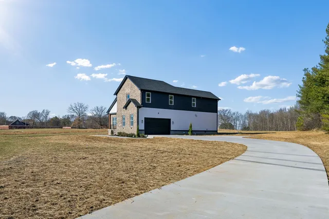 a view of hallway with wooden floor