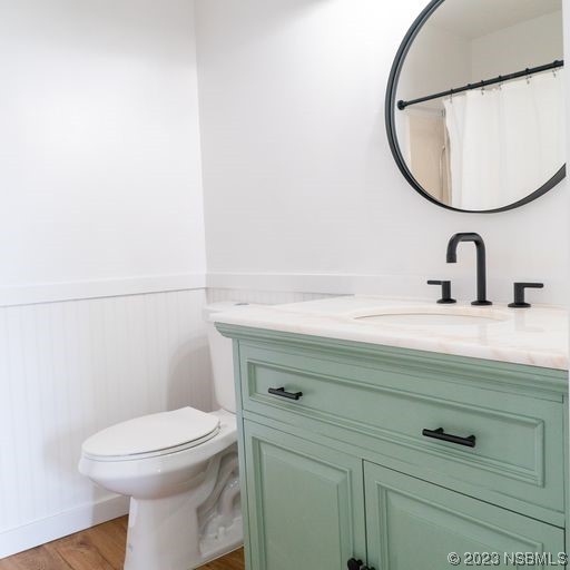 3219 Pine Tree Drive Edgewater, FL 32141 - Photo 6 of 13 a bathroom with a sink mirror and toilet