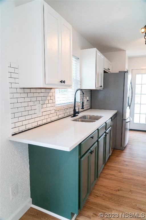 3219 Pine Tree Drive Edgewater, FL 32141 - Photo 10 of 13 a kitchen with stainless steel appliances kitchen island a sink stove and cabinets
