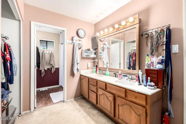 a bathroom with a sink vanity and a mirror