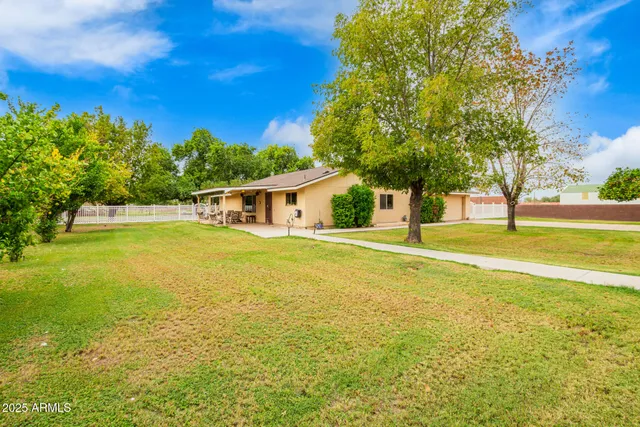 a house view with swimming pool in front of it