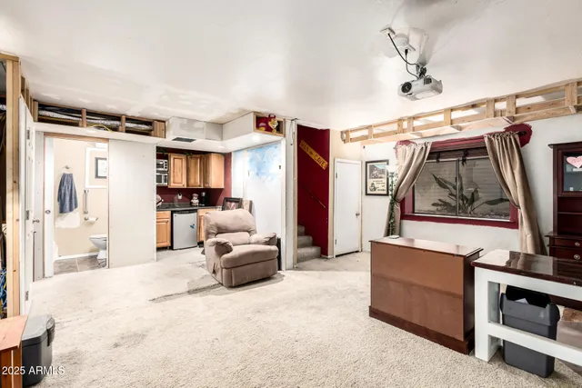 a view of living room with furniture and a window