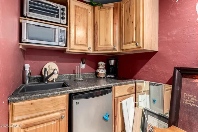 a kitchen with stainless steel appliances granite countertop a sink and cabinets