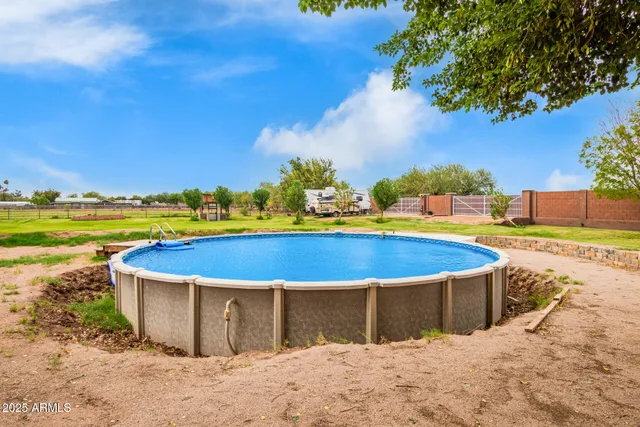 a view of a swimming pool with an outdoor seating