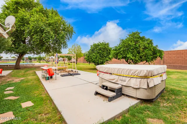 an outdoor space with patio and swimming pool