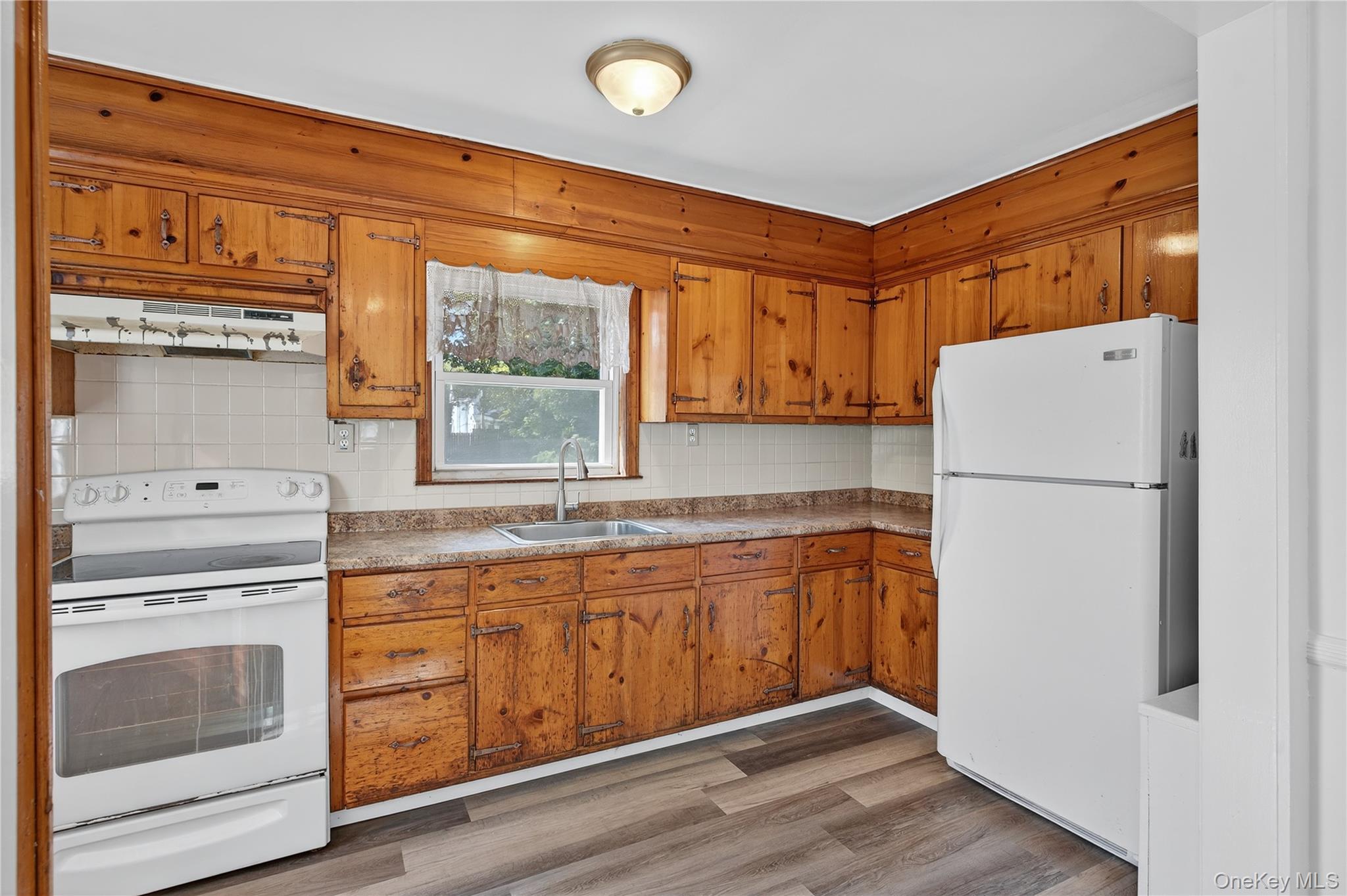 10 Howe Street Warwick, NY 10990 - Photo 13 of 33 a kitchen with a refrigerator stove and sink
