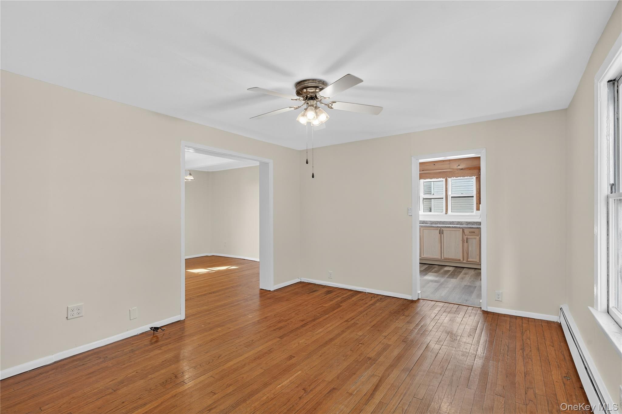 10 Howe Street Warwick, NY 10990 - Photo 19 of 33 wooden floor in an empty room with a window