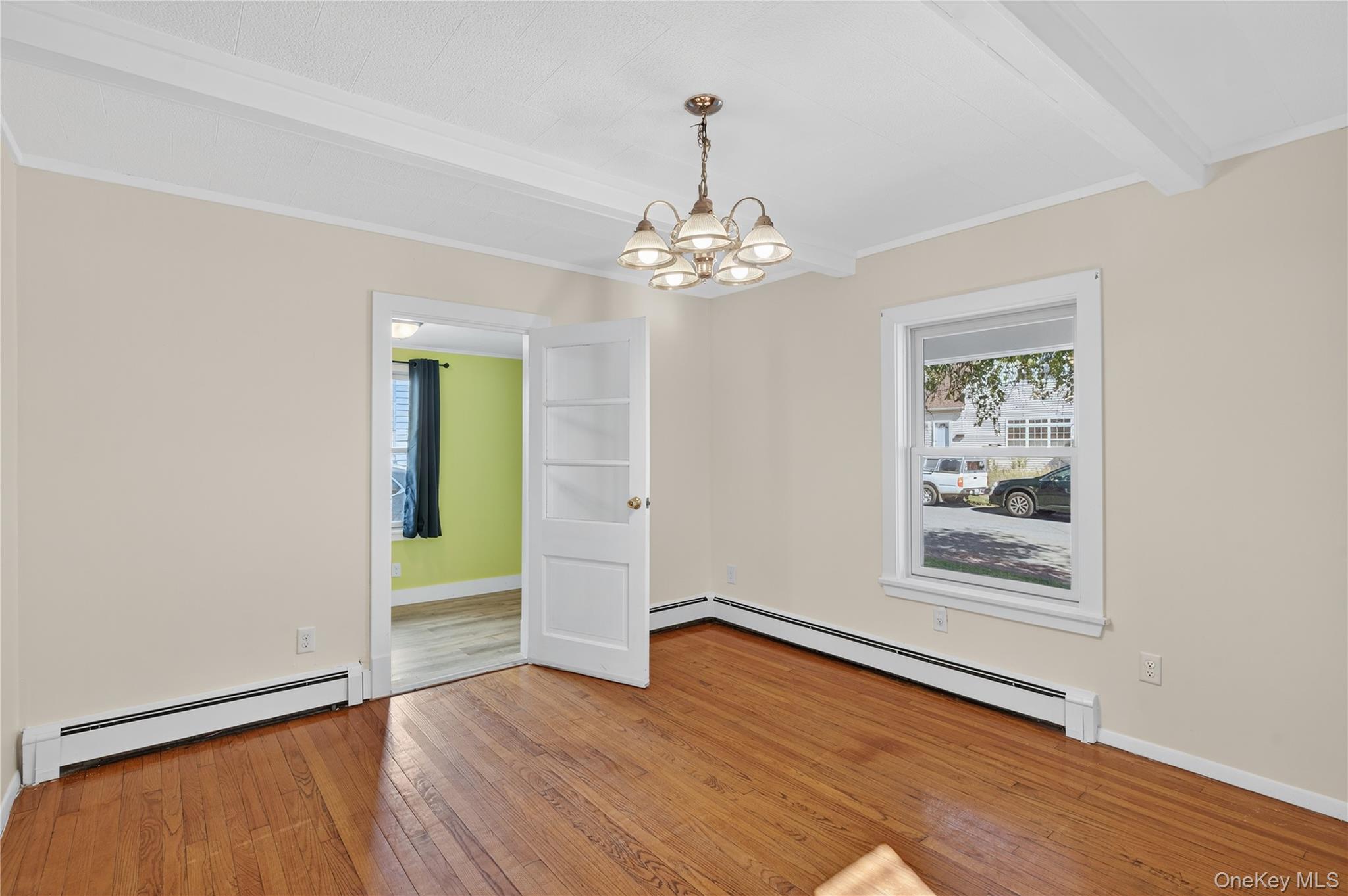10 Howe Street Warwick, NY 10990 - Photo 20 of 33 wooden floor in an empty room with a window