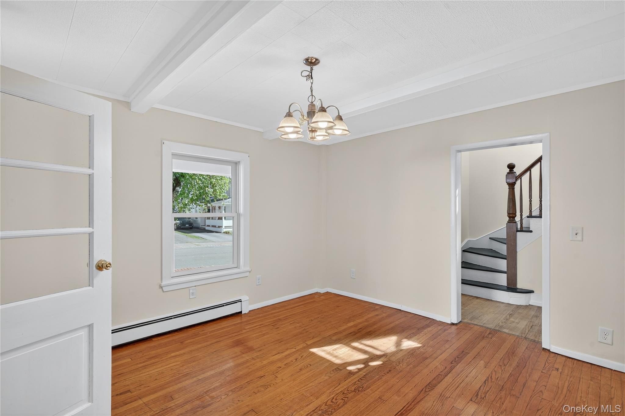 10 Howe Street Warwick, NY 10990 - Photo 21 of 33 wooden floor in an empty room with a window