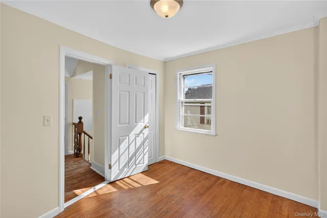 a view of an entryway with wooden floor