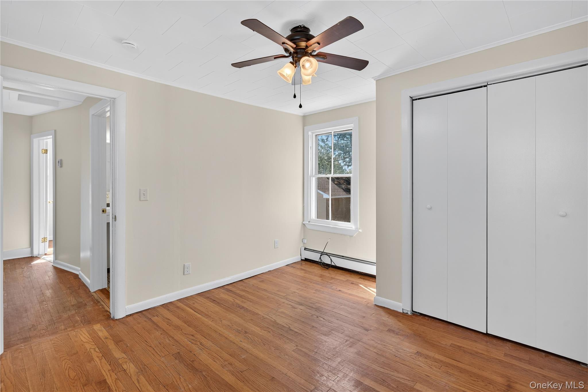 10 Howe Street Warwick, NY 10990 - Photo 29 of 33 a view of an empty room with window and wooden floor