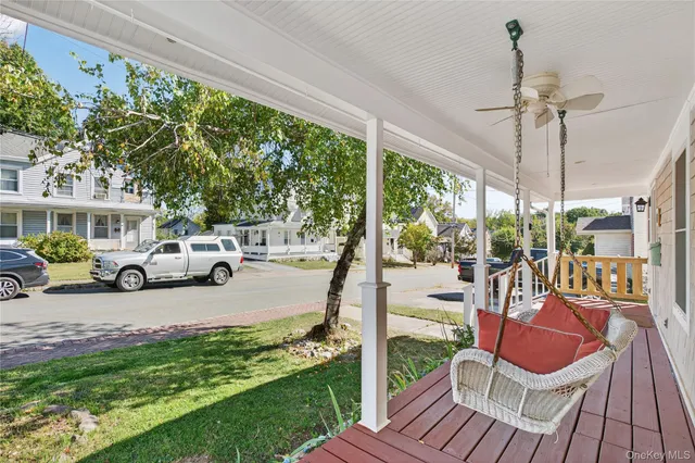 a view of a patio with couches chairs and potted plants