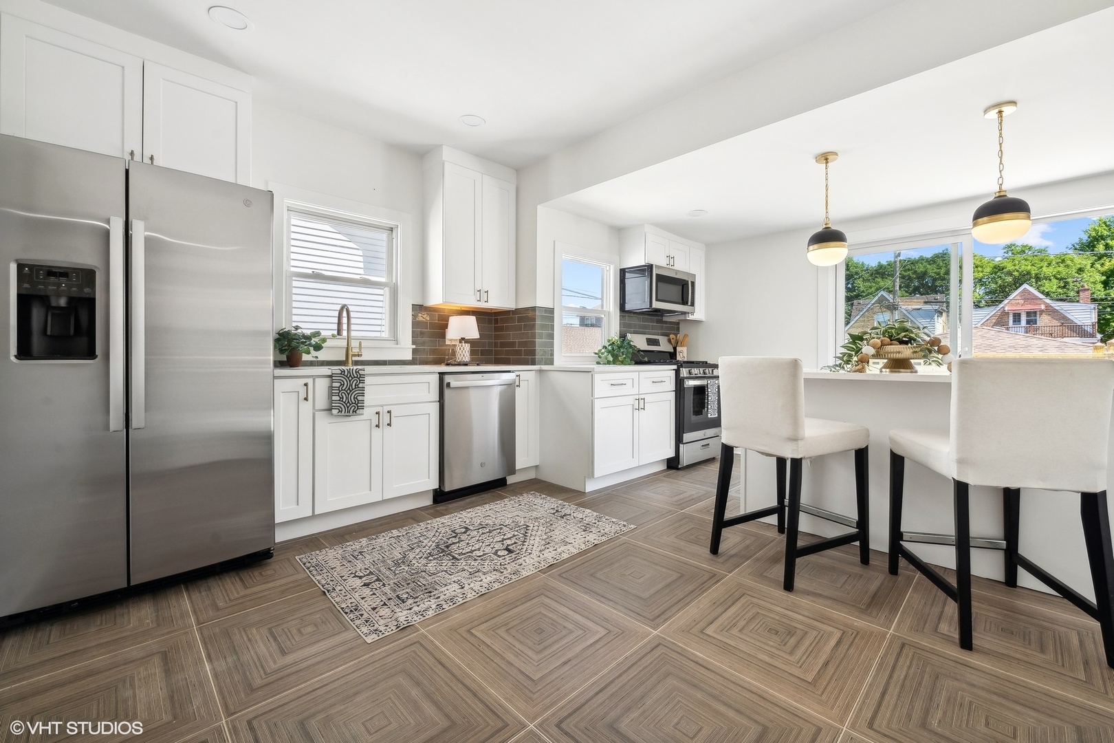 5435 North Lieb Avenue Chicago, IL 60630 - Photo 12 of 29 a kitchen with white cabinets and appliances
