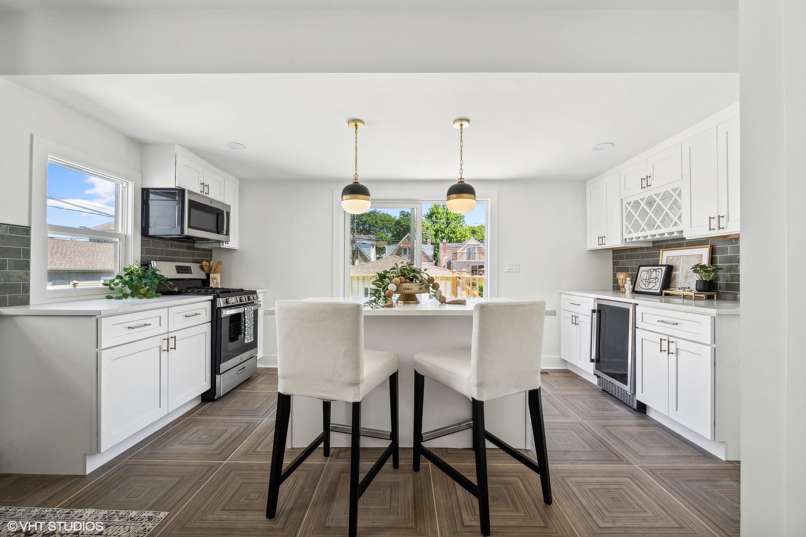 5435 North Lieb Avenue Chicago, IL 60630 - Photo 17 of 29 a kitchen with stainless steel appliances kitchen island granite countertop a sink a stove and cabinets