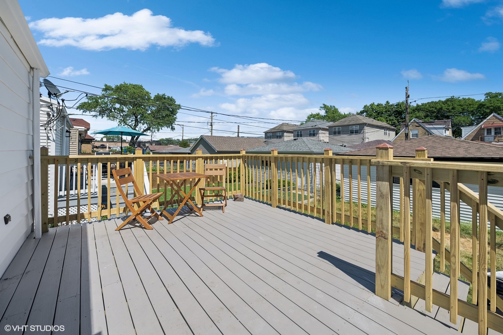 5435 North Lieb Avenue Chicago, IL 60630 - Photo 20 of 29 a view of a balcony with wooden chairs and wooden floor