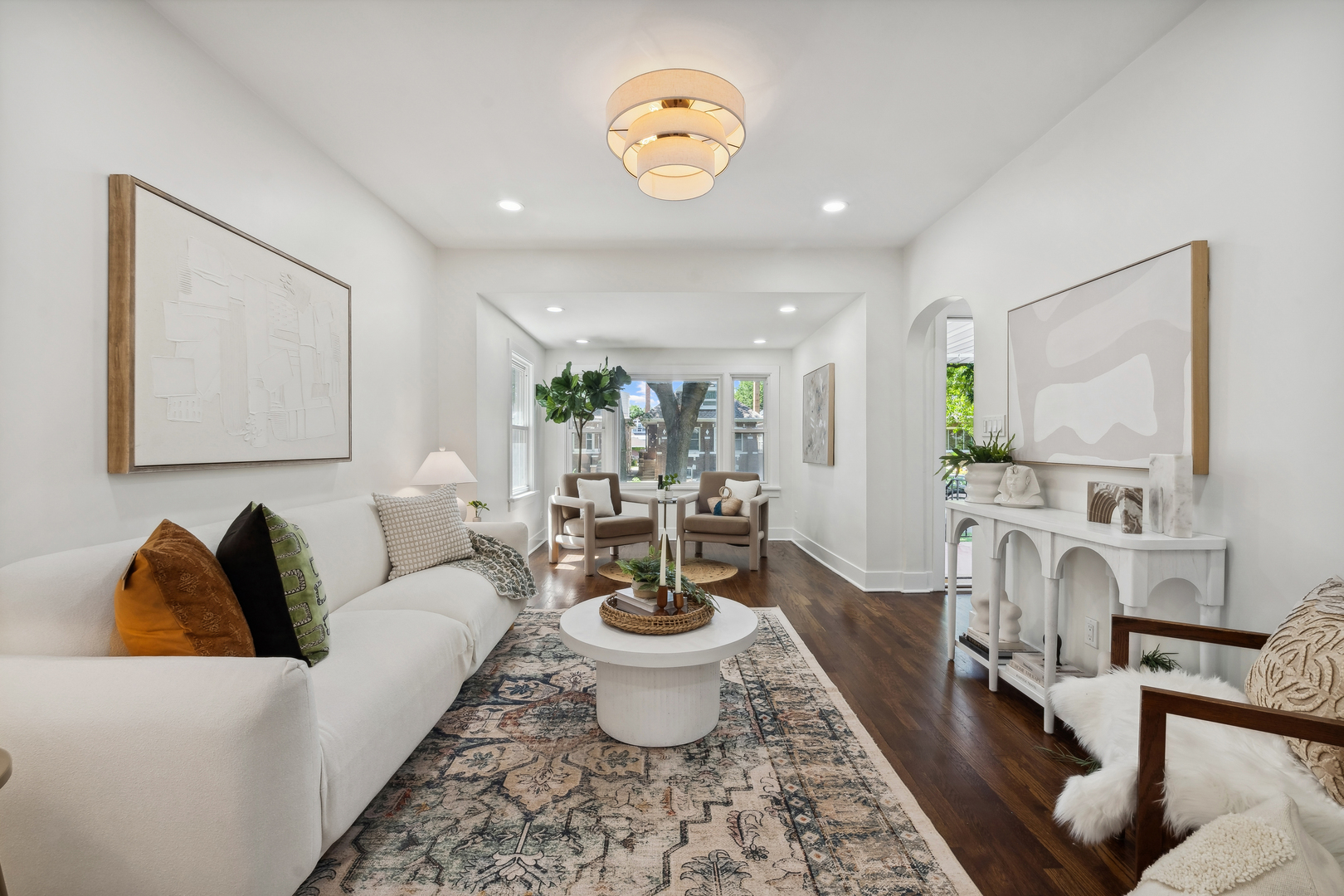 5435 North Lieb Avenue Chicago, IL 60630 - Photo 2 of 29 a living room with furniture and a chandelier