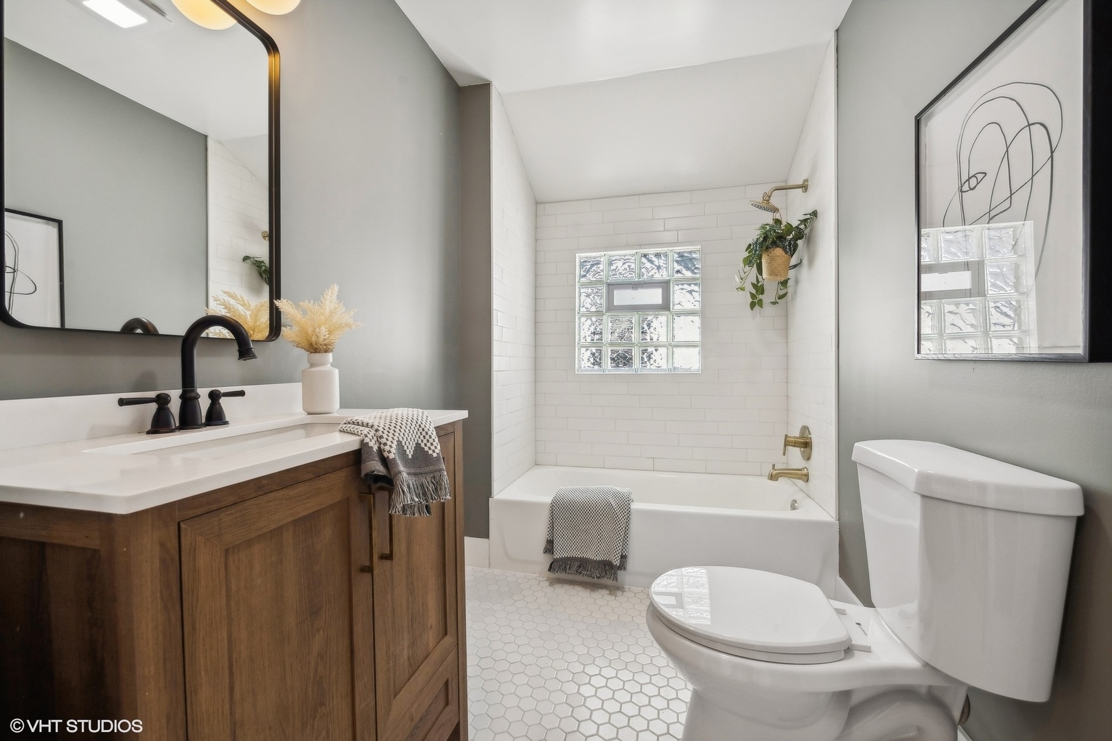 5435 North Lieb Avenue Chicago, IL 60630 - Photo 23 of 29 a bathroom with a sink toilet and shower