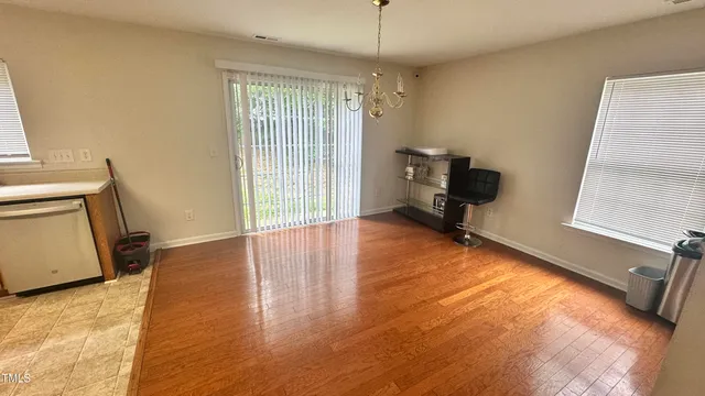 a view of a livingroom with furniture and a window