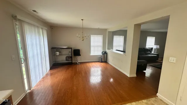 a view of a kitchen cabinets and wooden floor