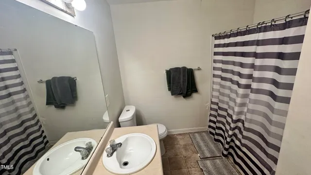 a bathroom with a toilet and a sink