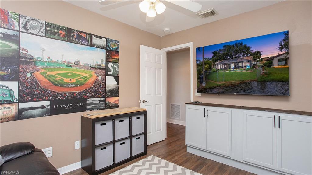 17269 Lee Road Fort Myers, FL 33967 - Photo 15 of 26 Living room featuring dark hardwood / wood-style floors and ceiling fan