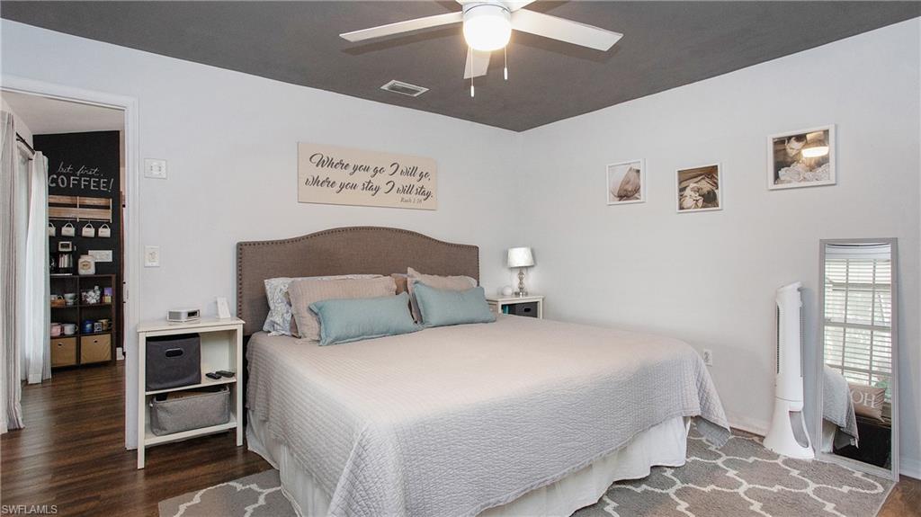 17269 Lee Road Fort Myers, FL 33967 - Photo 9 of 26 Bedroom featuring dark hardwood / wood-style flooring and ceiling fan