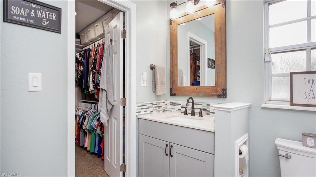 17269 Lee Road Fort Myers, FL 33967 - Photo 10 of 26 Bathroom with vanity and toilet