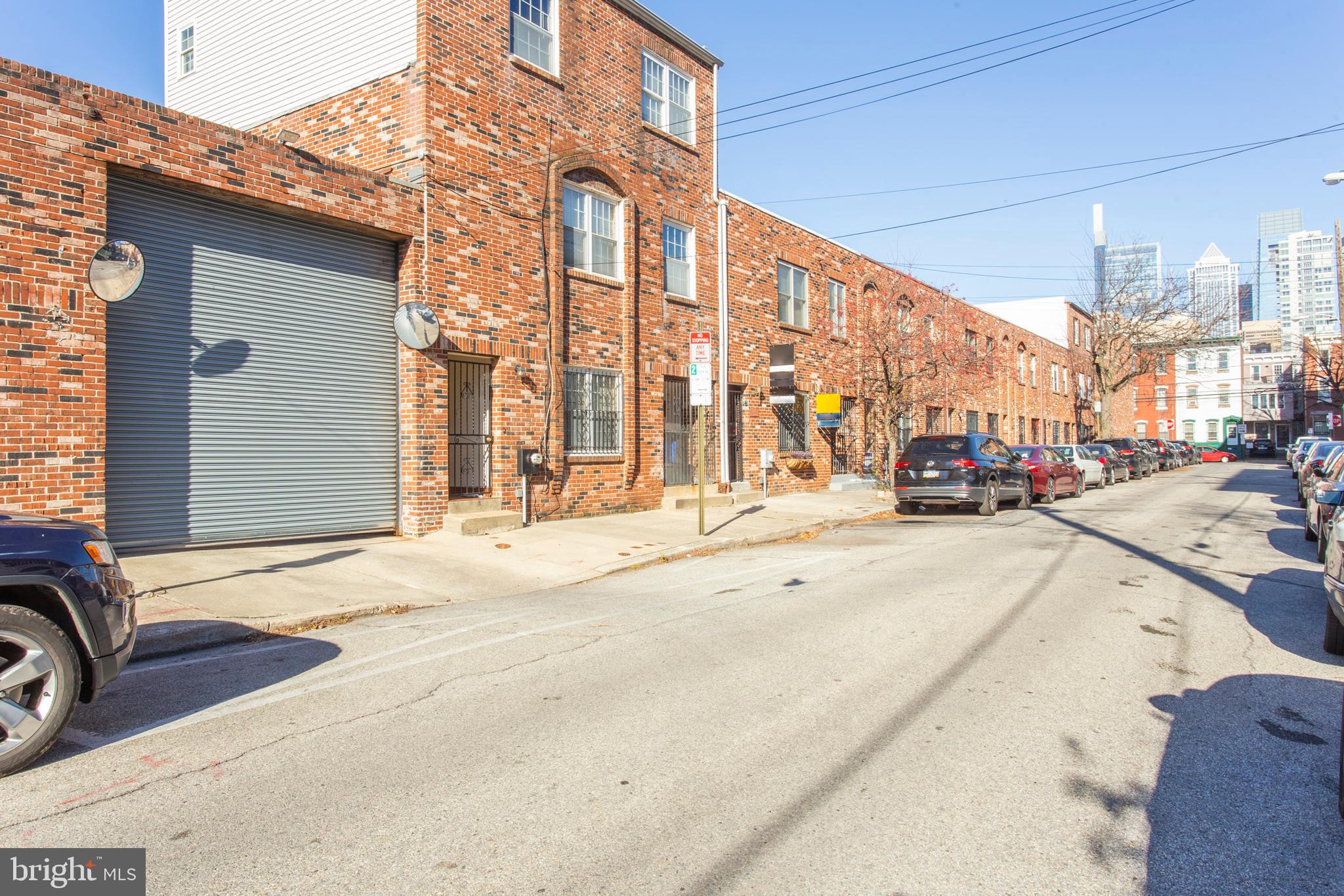 a building with car parked in front of it